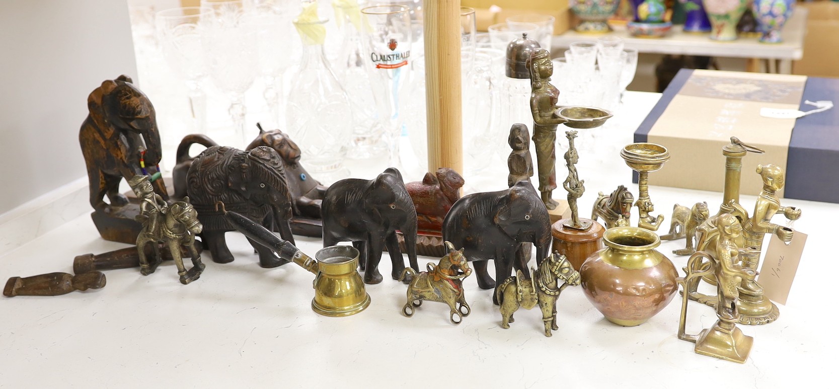 A quantity of Indian carvings and cast brass figures, tallest 20cm